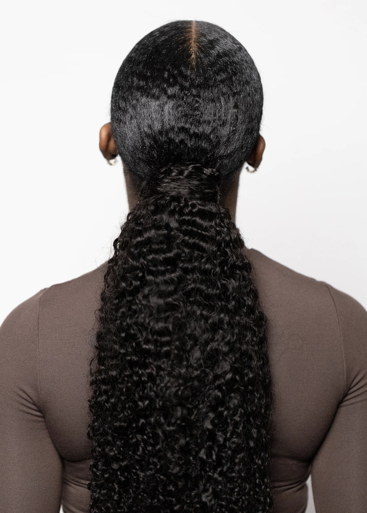 Corkscrew curly wrapped ponytail back view two