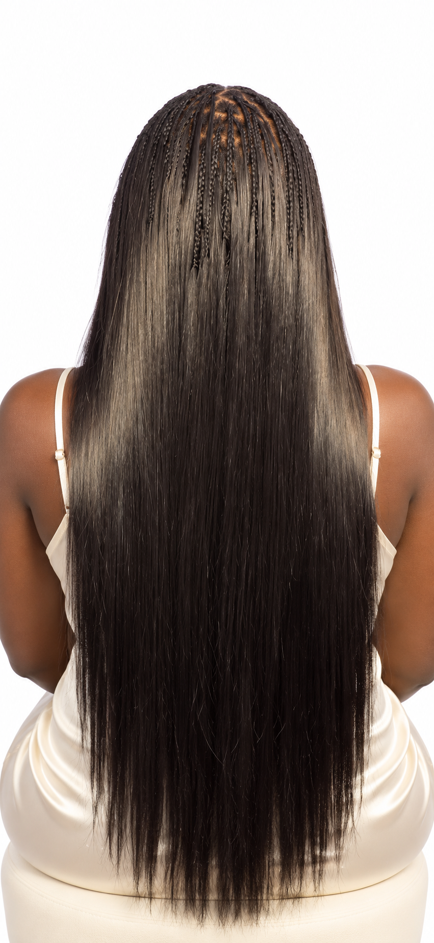 Long black straight boho braids falling down the back against a white background