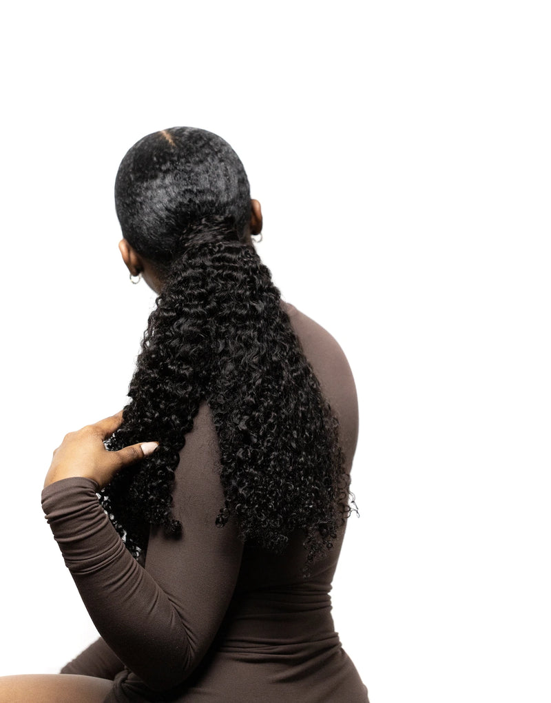 Corkscrew curly wrapped ponytail side view three
